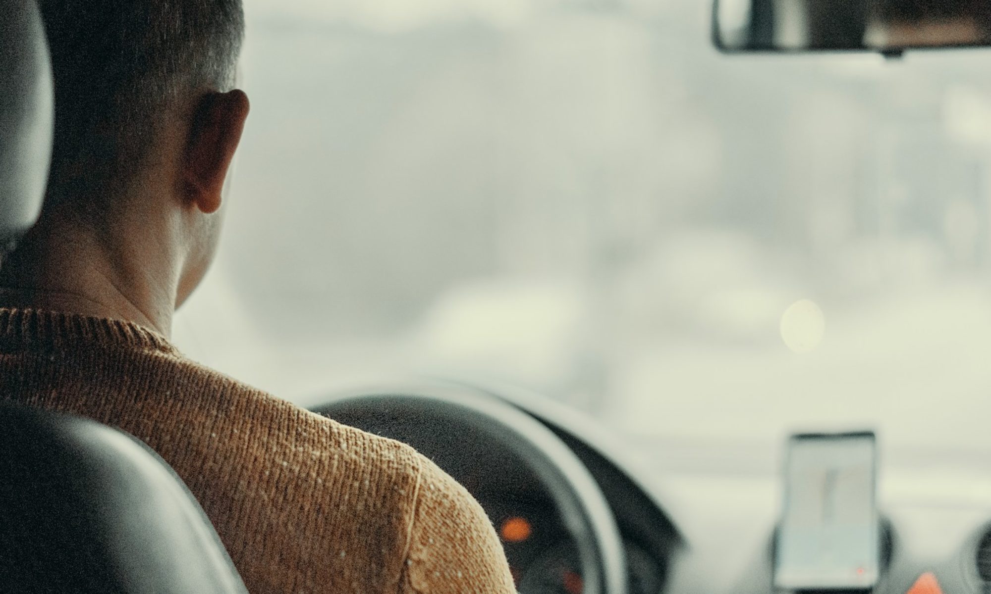 man driving vehicle